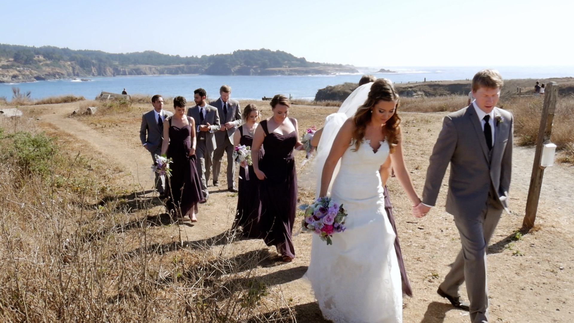 mendocino wedding video - bridal party walking back from bluff overlooking ocean in mendocino