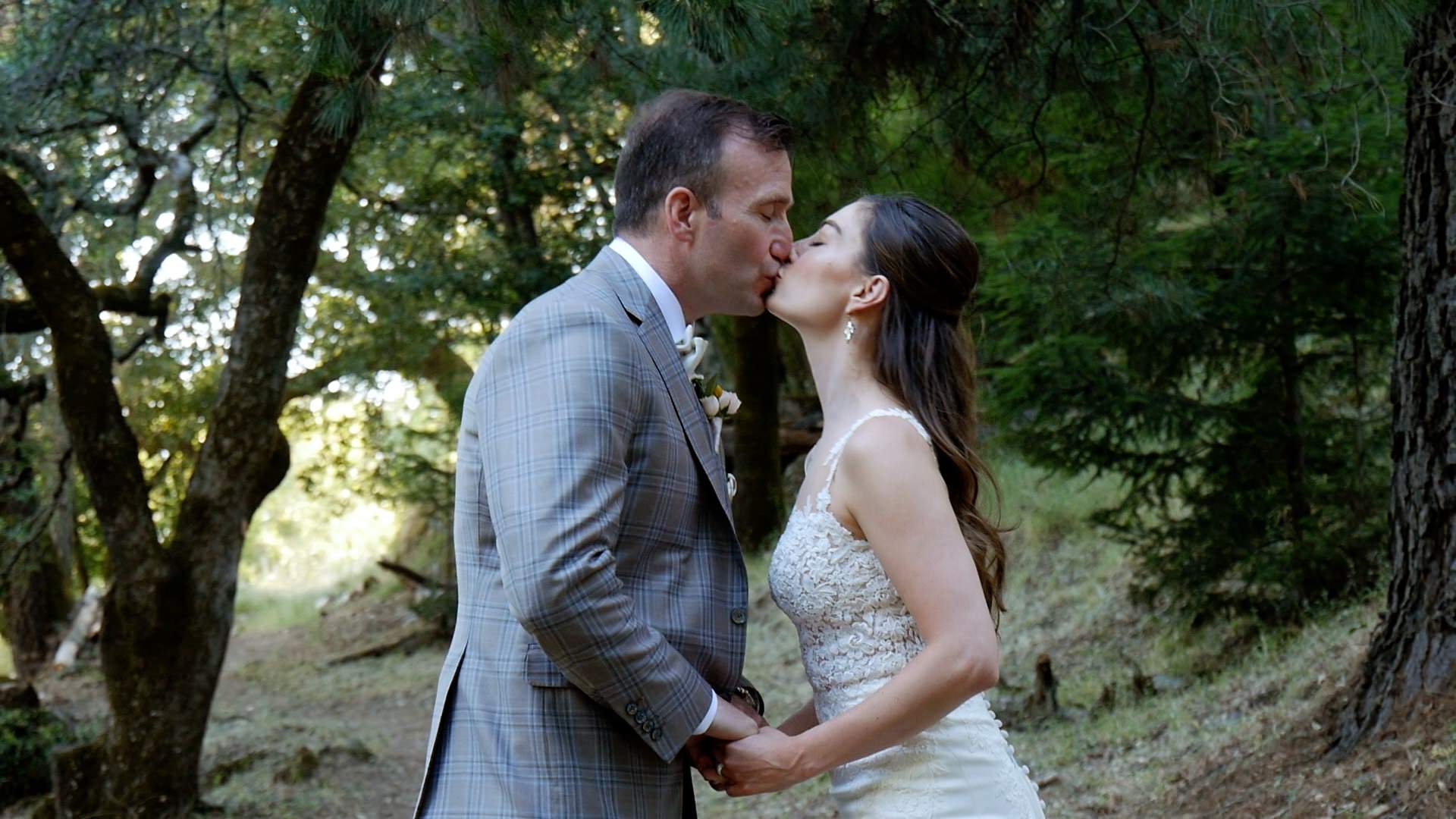 bride and groom kissing in the forest or woods at calistoga ranch napa valley