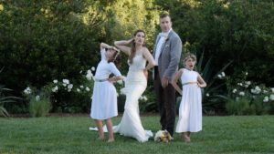 newlwed bride and groom pose with daughters at calistoga ranch, napa