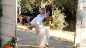 Carrying bride after ceremony